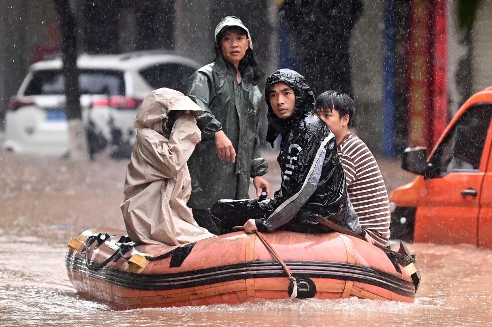 Southern China floods trigger evacuations as roads submerge
