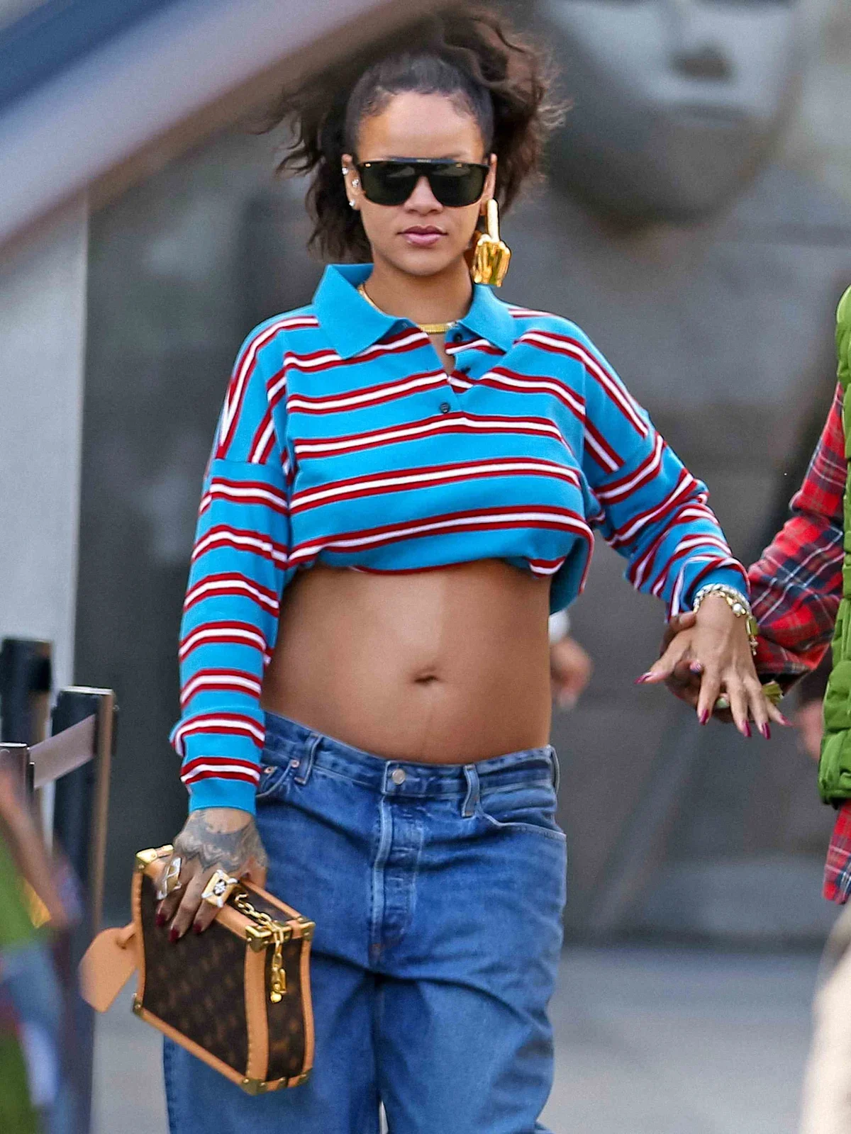 Rihanna Rocks Bump-Baring Striped Crop Top.