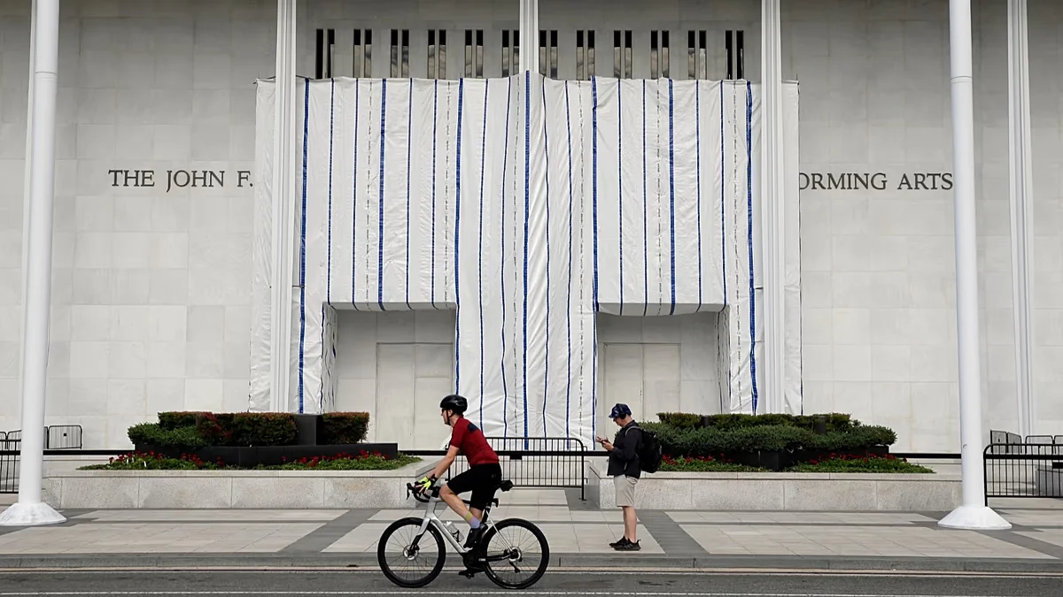 Tarps shield the moment as Trump's Kennedy Center name is removed amid mockery