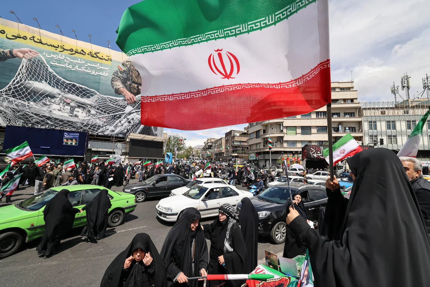 Iranian crowds mark ceasefire with flags of defiance as war pause unfolds