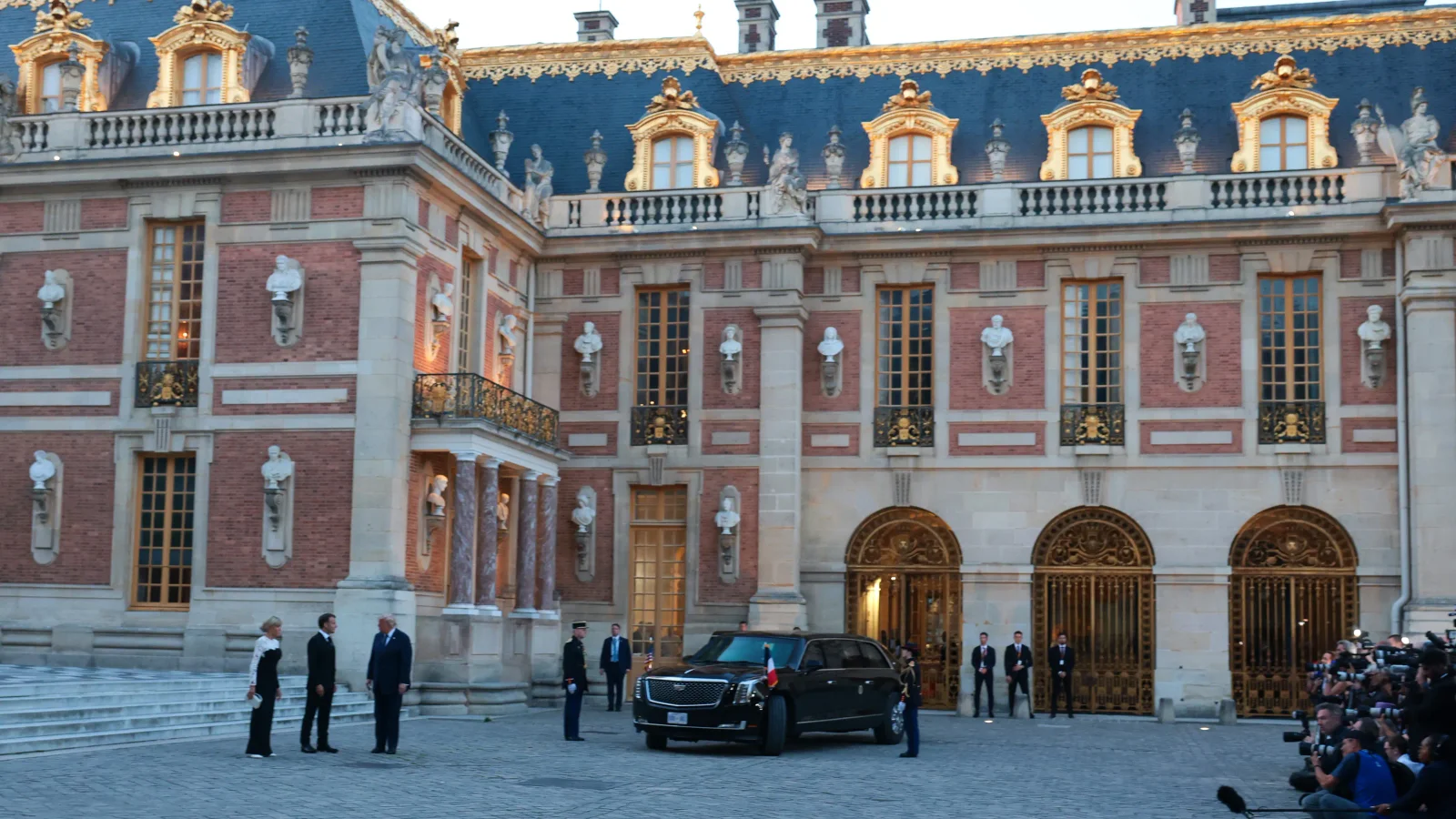 Trump delays return after Macron invites him to Versailles dinner