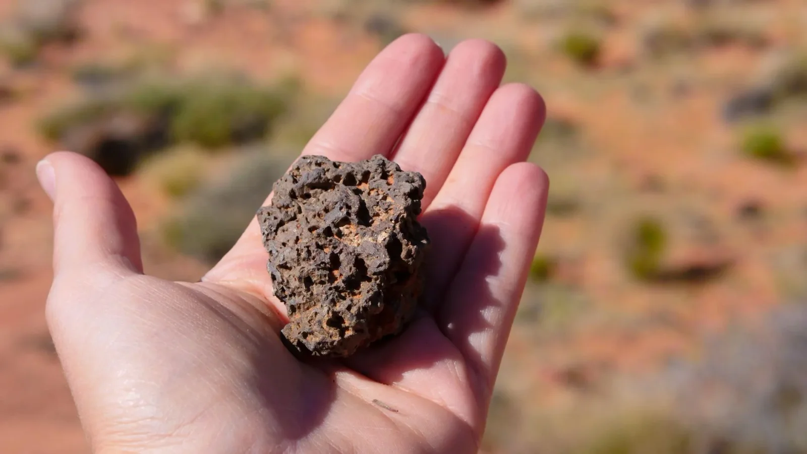 Desert rock hints at a moon-sized world shattered in the Sun’s early days