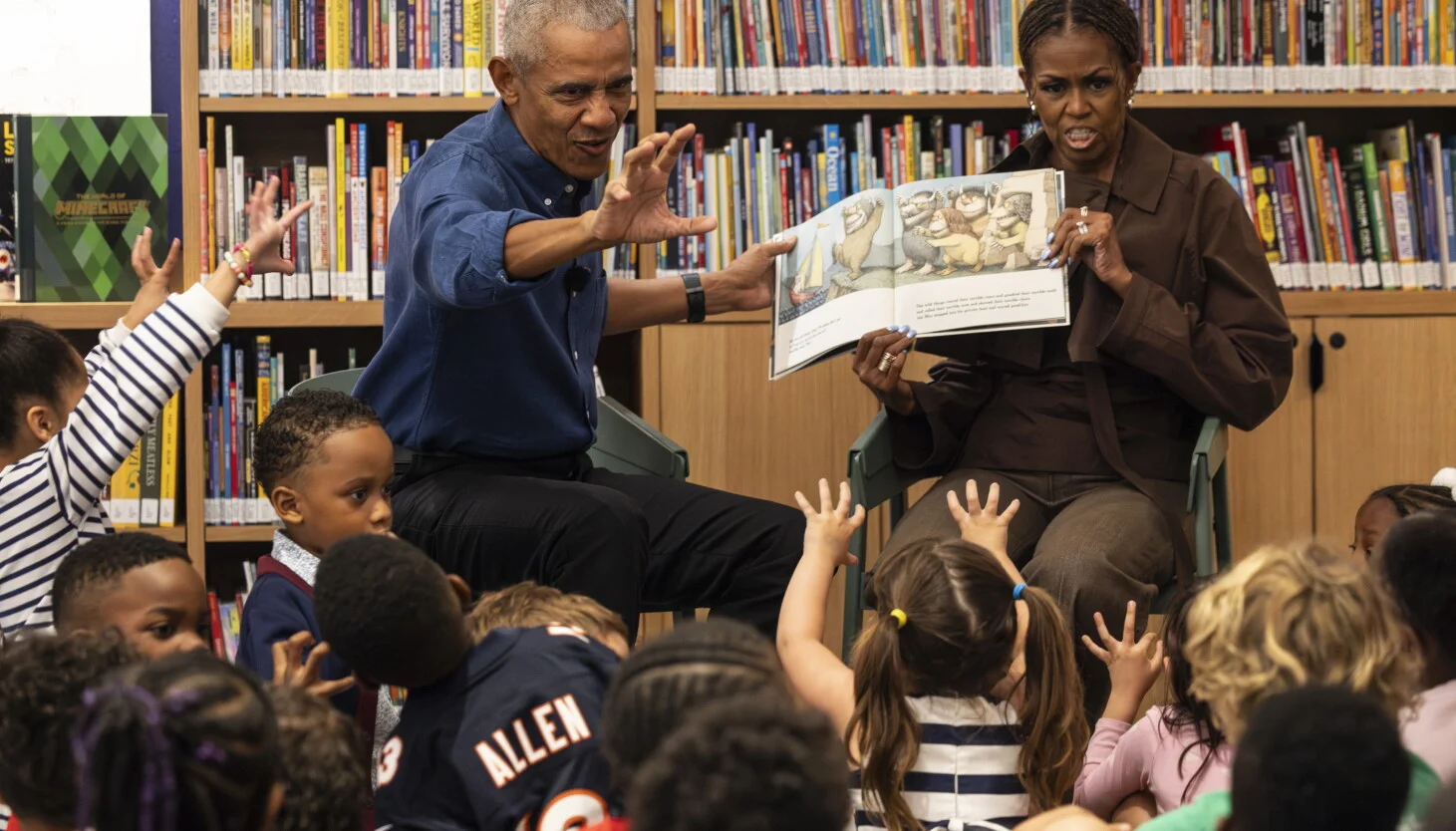 Barack and Michelle Obama greet Chicago students at center's public library opening