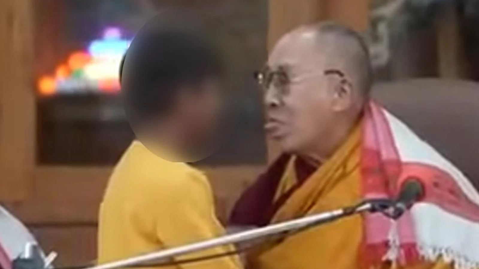 Tibetan leader defends Dalai Lama's controversial kiss remark.