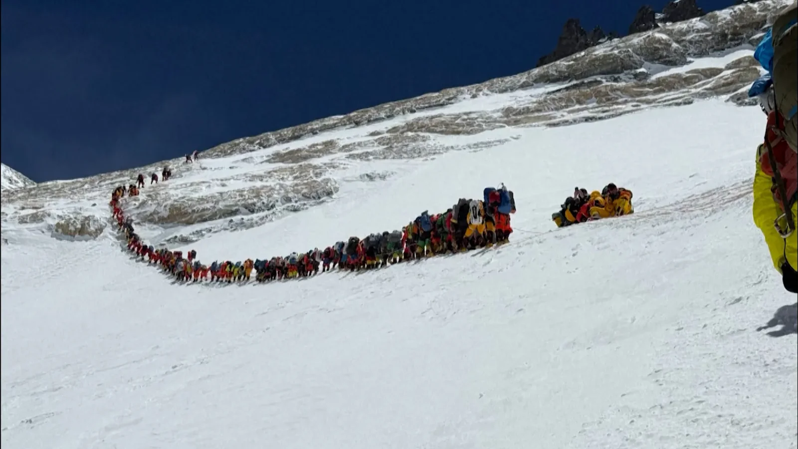 Everest sets new single-day summit record as crowds raise safety concerns