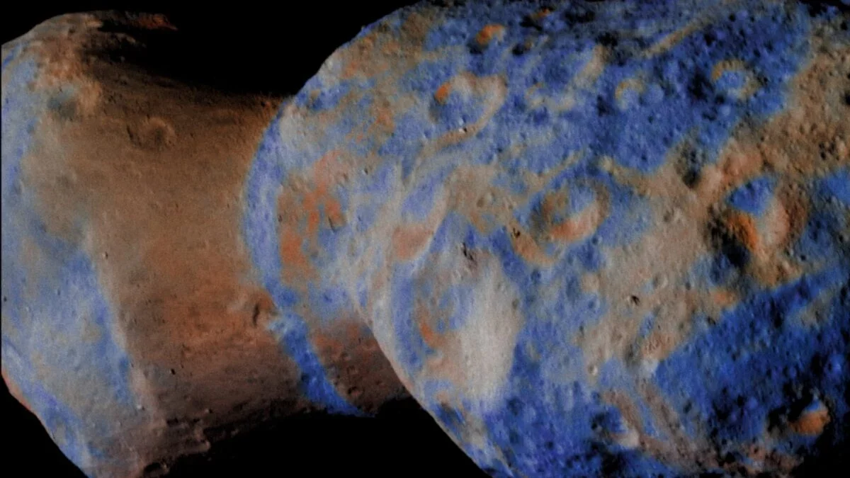 Lucy’s Close Encounter Reveals a Water-Rich Fragment from a Violent Ancient Collision