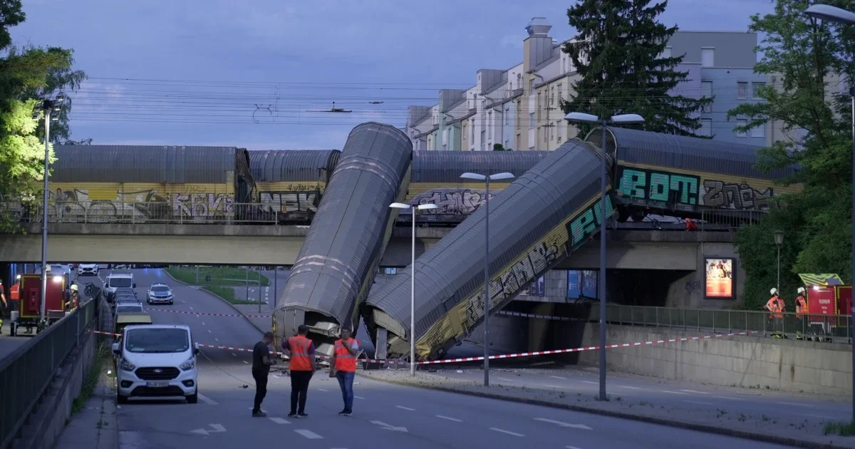 Munich freight-train derailment leaves one dead as cars plunge onto street