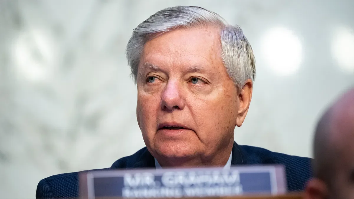 Lindsey Graham defends Trump, criticizes Biden for sending troops to southern border amidst expected surge.