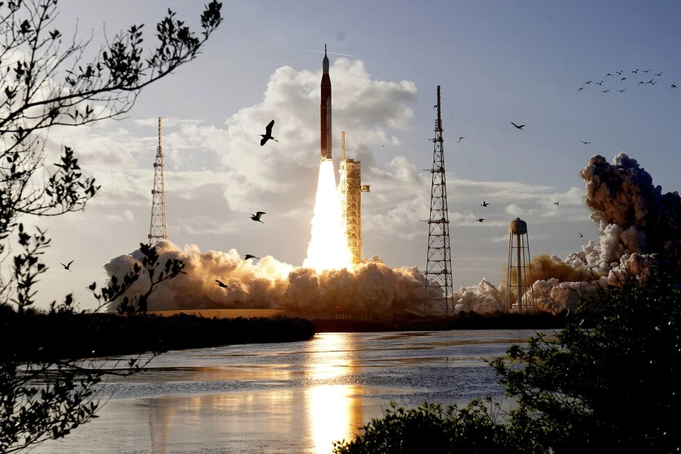 Sound-triggered remote camera captures Artemis II launch as birds take flight
