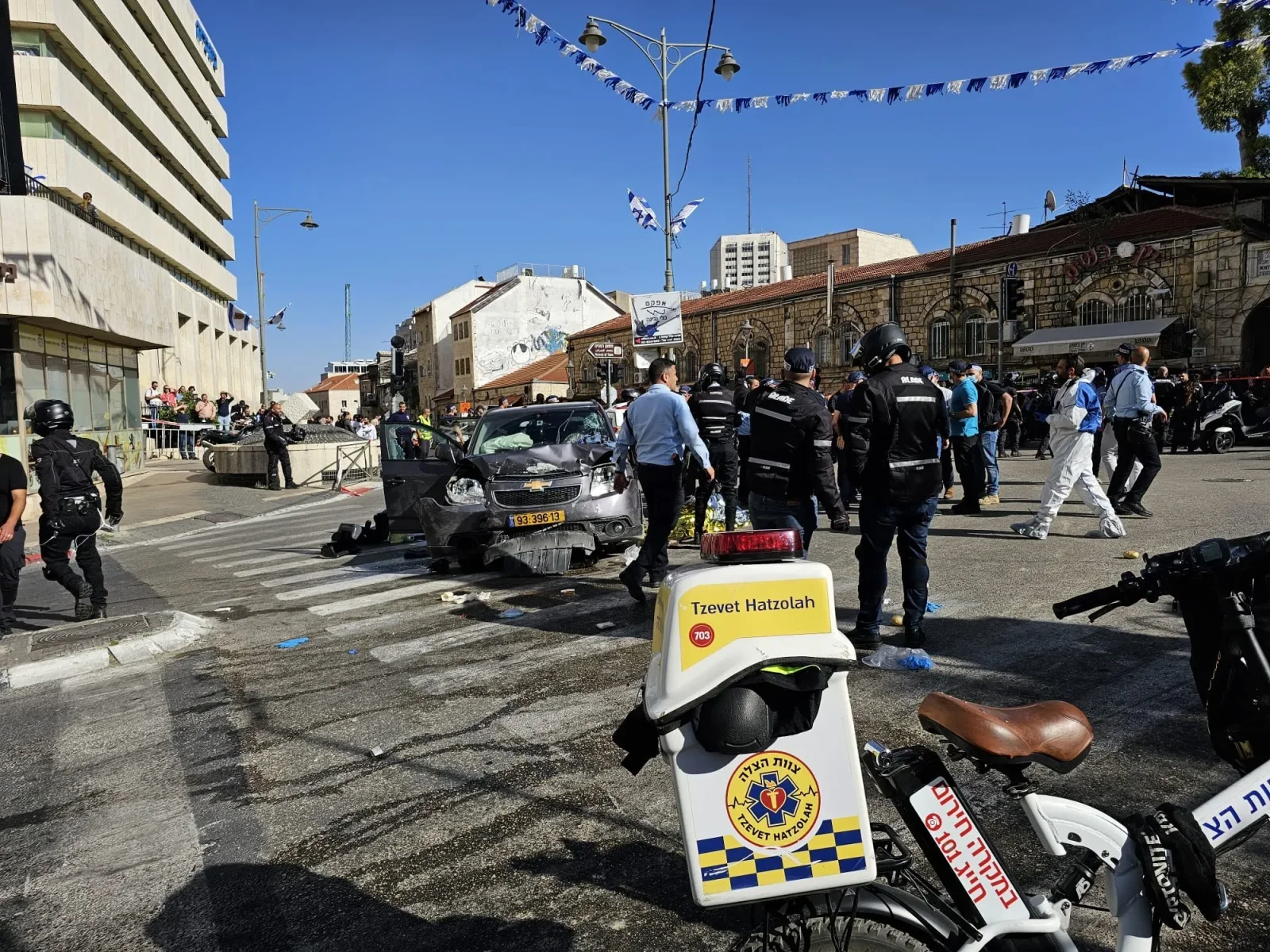 Jerusalem market hit by Palestinian car-ramming attack, 5 injured.